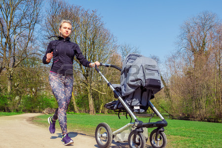 27462774-young-mother-jogging-with-a-baby-buggy